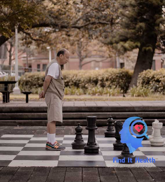 Playing chess guide to good health and aging well senior Asian man